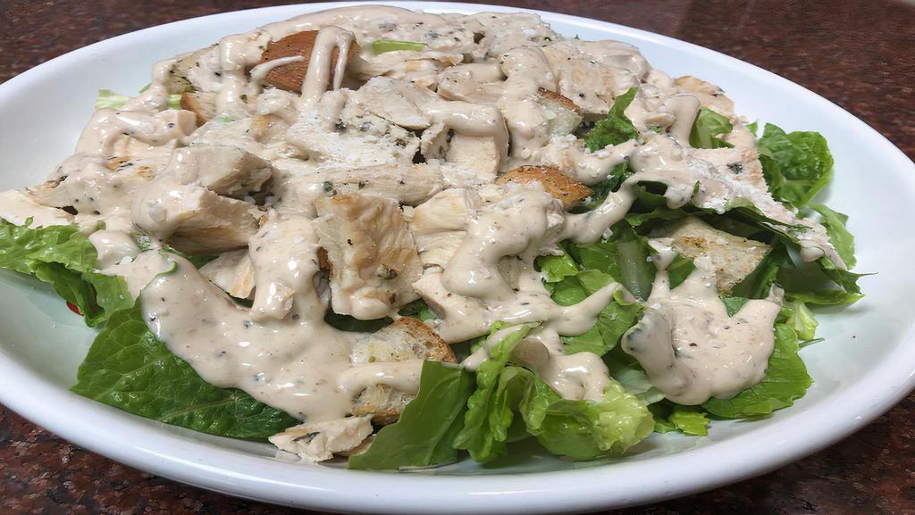 #18 Grilled Chicken Caesar Salad · Prepared with romaine lettuce, croutons Caesar dressing and grated Parmigiano cheese.
