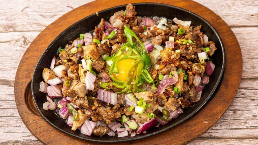 Sisig · Sautéed Chopped Onions, Green Chili, Egg served on a Sizzling Plate.
