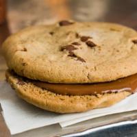 Chocolate Chip Cookie Nutella Sandwich · Two chocolate chip cookies with Nutella spread in-between.