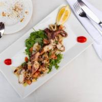 La Grigliata · Grilled octopus, grilled calamari served over arugula salad, and covered in an Italian dress...