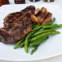 Grilled Rib Eye Steak · (18 oz) certified black Angus rib eye grilled to your liking and covered in Mama Rao's Itali...