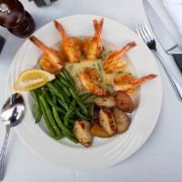 Shrimp Oreganata · Jumbo shrimp breaded and baked in a white wine lemon sauce.