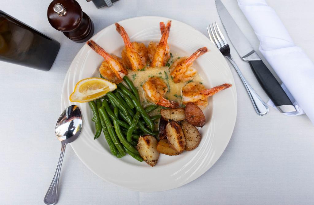 Shrimp Oreganata · Jumbo shrimp breaded and baked in a white wine lemon sauce.