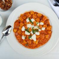 Gnocchi Posillipo · Sauteed in a fresh tomato sauce with melted mozzarella, parmigiano cheese, and fresh basil.