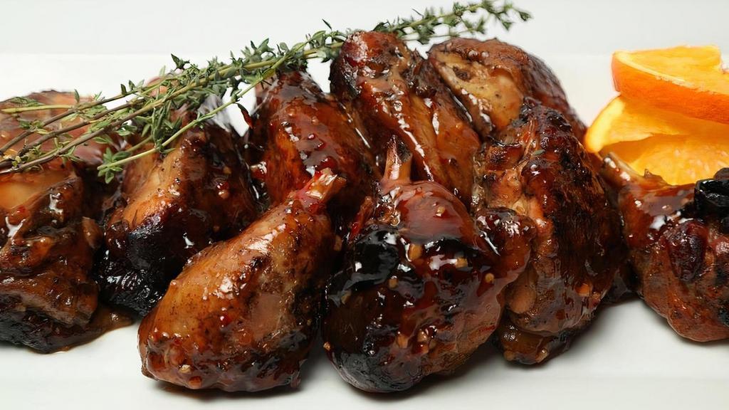 Jerk Chicken · Chicken pieces on the bone, cut up and baked with a tradition Jamaican spicy jerk seasoning. GF