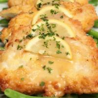 Chicken Francaise · Boneless chicken breast sauteed in an egg batter and served with a sauce of butter, white wi...