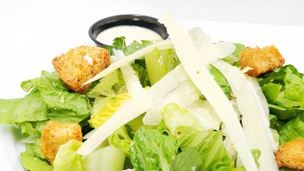 Cesar Salad · Fresh Romaine lettuce homemade crotons and fresh shaved Parmigianino Reggiano with Cesar dressing