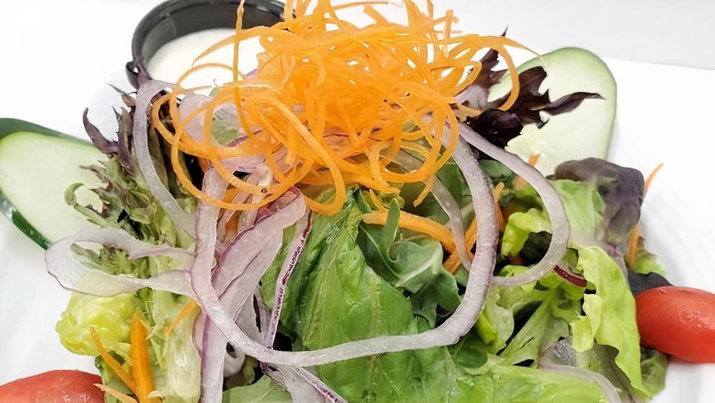 Mixed Green Salad · Mixed greens carrots onions and balsamic vinaigrette dressing