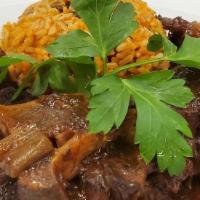 Oxtail With Rice & Peas · Yes our Famous Oxtail served with a side of Rice & Peas. (Box meals are minimum order of 30 ...