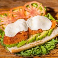 Crispy Chicken Sandwich · Crispy chicken cutlet with fried tropical cheese, shredded lettuce, and sweet ripe tomato an...