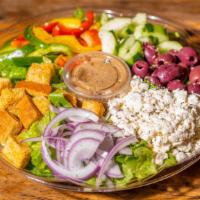 Greek Salad · Feta cheese, plum tomatoes, kalamata olives, red onions, bell peppers, cucumbers house made ...