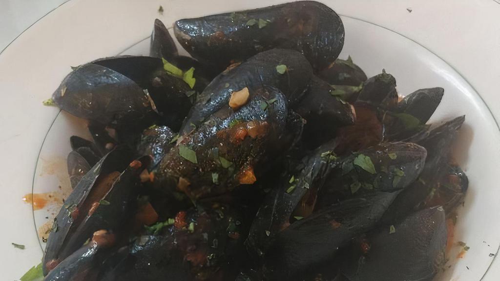 Zuppa Di Cozze · Sautéed mussels prepared in a red or white sauce with a garlic crostini.
