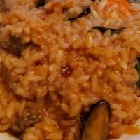Milanese · Saffron, grated parmigiano, beef broth & arborio rice.