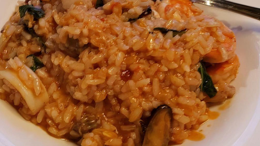 Milanese · Saffron, grated parmigiano, beef broth & arborio rice.
