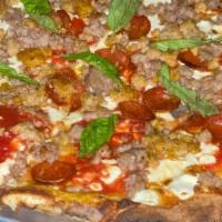 Macellaio · Pomodoro sauce, homemade mozzarella, sausage, meatballs, pepperoni, basil, pecorino romano, ...