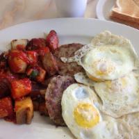 The Big Breakfast · Pancakes, three eggs, home fries with bacon, Taylor ham ,sausage with toast.