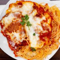 Chicken Parmigiana · Breaded chicken breast baked with tomato sauce with melted Mozzarella cheese. All entrees se...