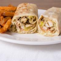 Chicken Shawarma Platter · Garlic sauce, pickles, serve on wrap with fries and salad.