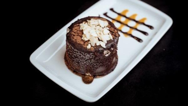 Chocolate Soufflé · Homemade, moist chocolate cake with creamy rich chocolate. Served with vanilla ice cream.