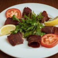 Pastrami Plate · Delicious Turkish pastrami served with hummus, shaved cheese, tomato slices, and arugula lea...