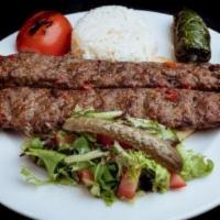 Lamb Adana Kebab · Ground lamb flavored with red bell peppers, slightly seasoned with paprika and grilled on sk...