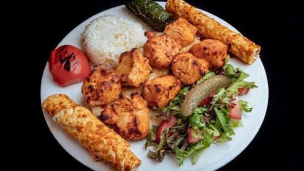 Chicken Shish Kebab · Marinated chicken chunks grilled on skewer served with rice and coleslaw.