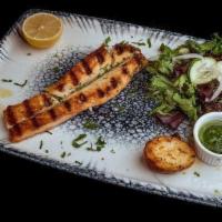 Grilled Salmon · Grilled salmon served with mashed potatoes and house salad.