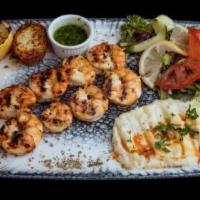 Grilled Jumbo Shrimp · Char grilled shrimps in our chief's delightfully light sauce served with mashed potatoes and...