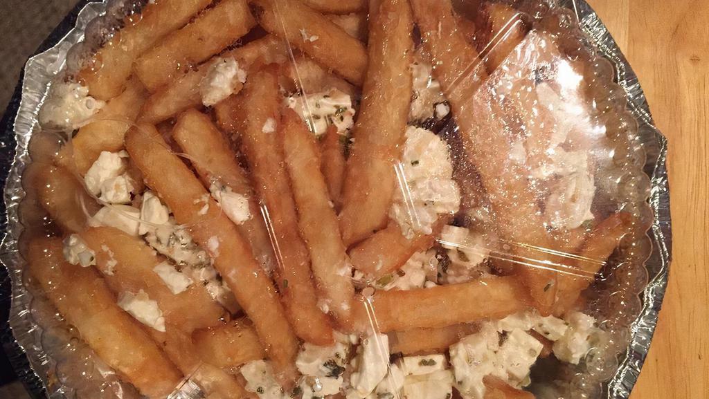 Greek Fries · Vegetarian. Crispy french fries, topped with feta cheese, lemon and oregano baked golden brown.