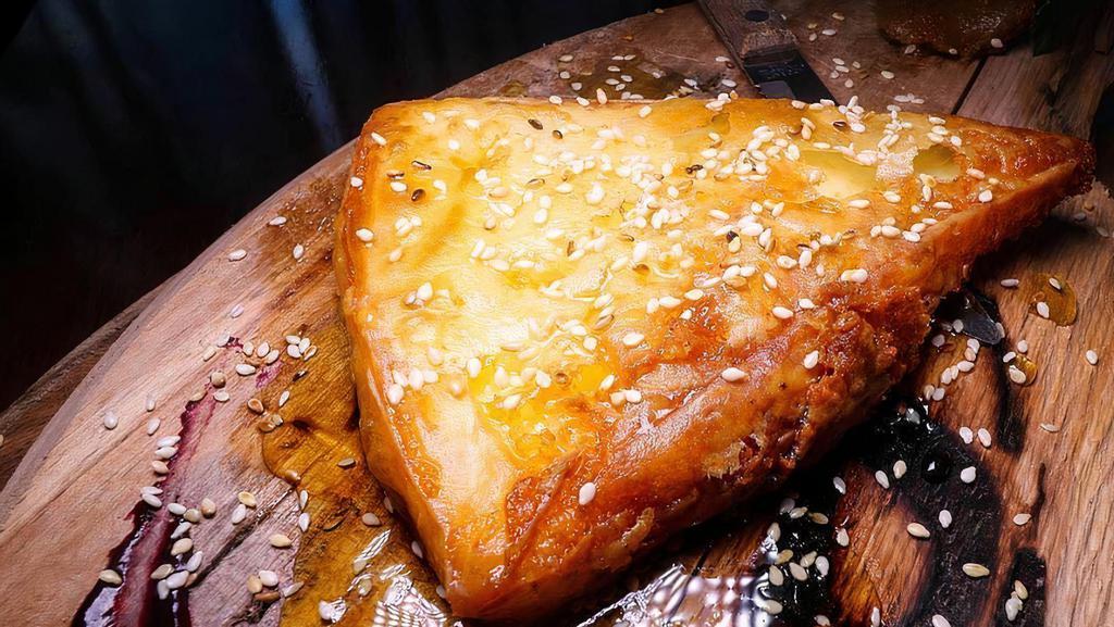 Saganaki · Broiled graviera cheese with lemon.