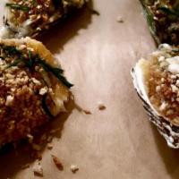 Roasted Oyster · Garlic breadcrumb, herb butter, and parmesan.