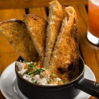 Fish Dip · Smoked trout, pickled onion, tabasco crema, cucumber, and crunchy bread.