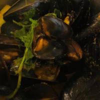 Thai Mussels · Curry coconut broth, lemongrass, kaffir lime, coriander, lime, and ginger.