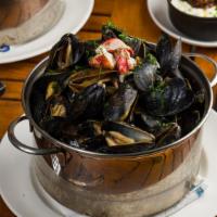 Bisque Mussels · Lobster, brandy, tomato, and cream.