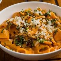 Spicy Alla Vodka · mezze rigatoni, tomato, cream, parmesan, torn basil, chile oil