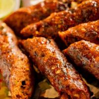 Lamb Seekh Kebab · Minced Goat meat seasoned with spices, skewered roasted until golden served with green chutney