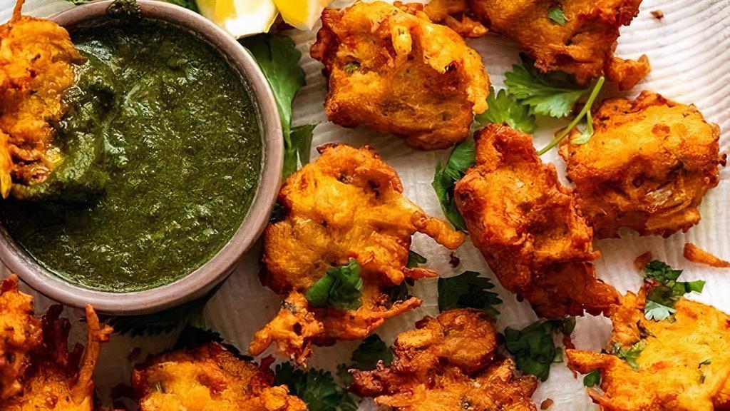 Veg. Pakora · Mix. Veg. Pakoras are crispy golden fried assorted vegetable fritters with gram flour batter with a side you sweet or sour chutney.