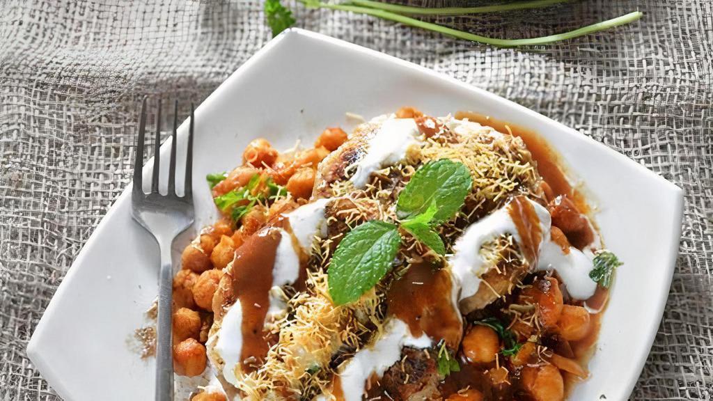 Aloo Ki Tikki Chaat With Chana · Crispy Potatoes patties filled Indian Masala served with sweet and sour chutney