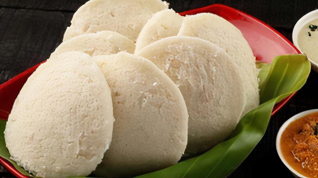Idli-Sambar (4 Pieces) · A popular South Indian snack made out of steamed rice & lentils served with Sambar and Coconut Chutney