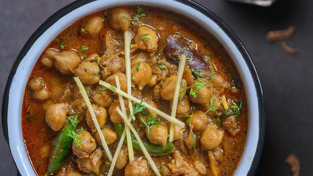 Chana Masala · Chickpeas prepared in fried onion-tomato based semi-dry Indian curry