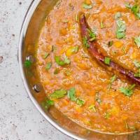 Yellow Dal Tadka · Yellow lentil stew which is seasoned with fried onion, tomato and spices.