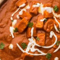 Paneer Tikka Masala · Soft cheese cubes along with crunchy capsicum and onions cooked in a mouth-watering tomato-b...