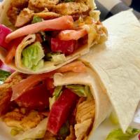 Chicken Shawarma Wrap · One of our best-sellers! Chicken shawarma wrapped with hummus, lettuce, tomatoes, pickles & ...