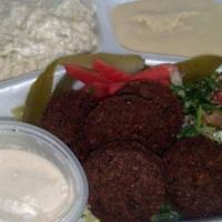 Falafel Platter · Falafel served with our homemade classic hummus, baba ganouj, tabouleh, pickles, pita bread,...