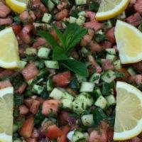 Middle Eastern Salad · Homemade with tomatoes, cucumbers, parsley, mint, lemon & olive oil