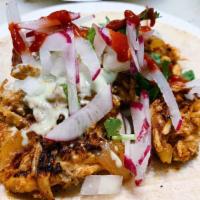 Tinga Taco · Shreded chicken in chipotle adobo.