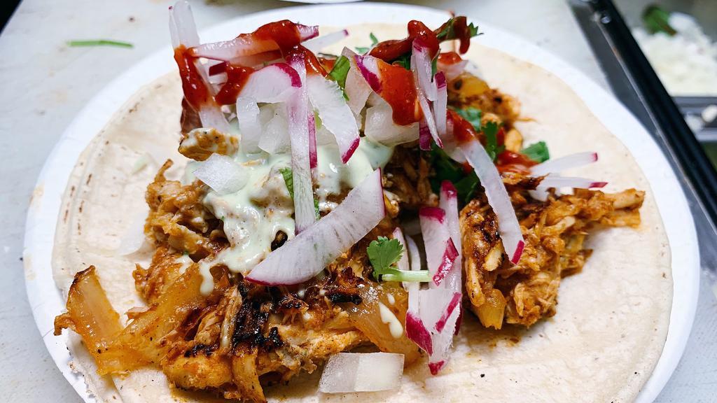 Tinga Taco · Shreded chicken in chipotle adobo.
