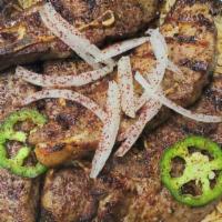 Lamb Chops · Five piece flame grilled lamb chops served with rice, salad, spinach and tandoori bread