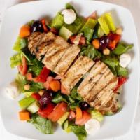 Signature · Grilled chicken, mozzarella, olives, field of greens (tomatoes, cucumbers, chick peas, roast...