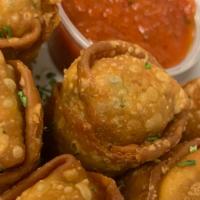Italian Egg Rolls · Three egg rolls filled with broccoli rabe and Italian sausage with a marinara dipping sauce.